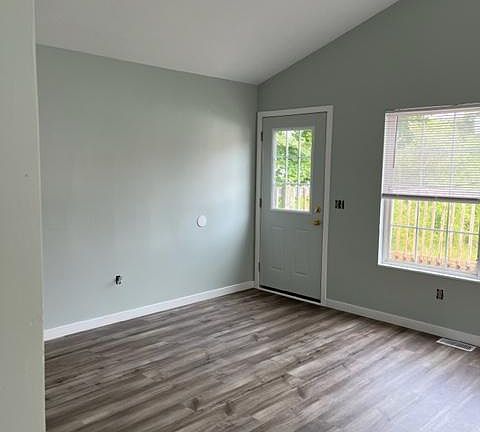 living room showing door to deck