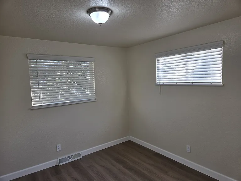 Bedroom 2 with sliding door closet.