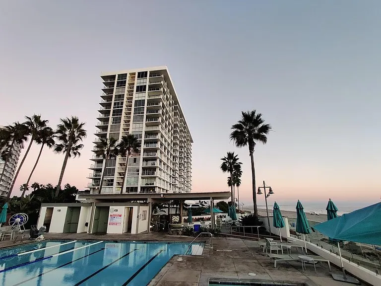 View of one the community swimming pool and El Camino Building in the backgroun