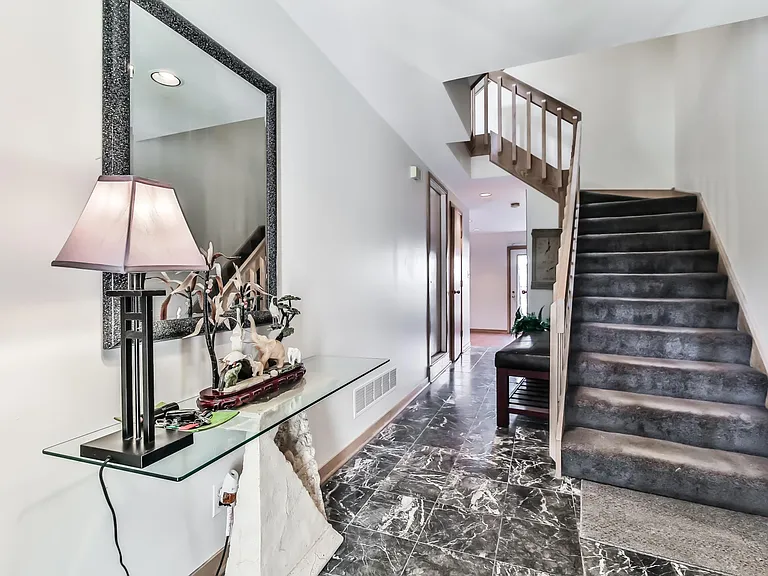 Front entrance foyer with marble tile