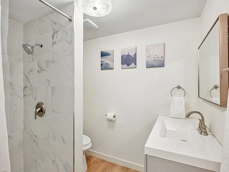 Modern Upstairs Bathroom: Walk-In Shower, Heat Lamp & Ample Storage