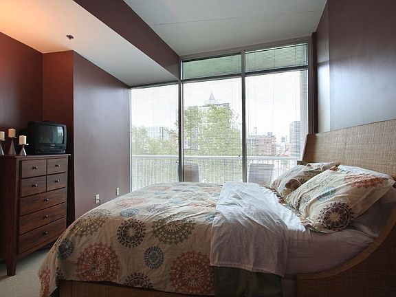 Bedroom is large and features his and hers closets.