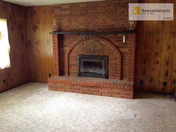 Main floor family room with fireplace & gas logs & hidden safe!