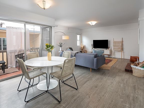 Dining to Living Room with Balcony