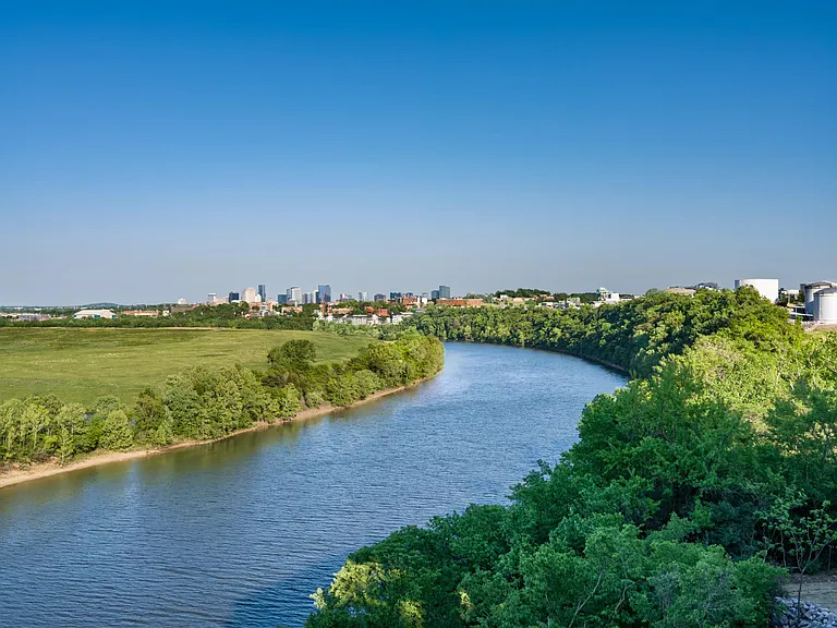 Sweeping river views with Nashville's skyline in the distance, placing residents near green space, waterfront vistas, and the city's creative energy.