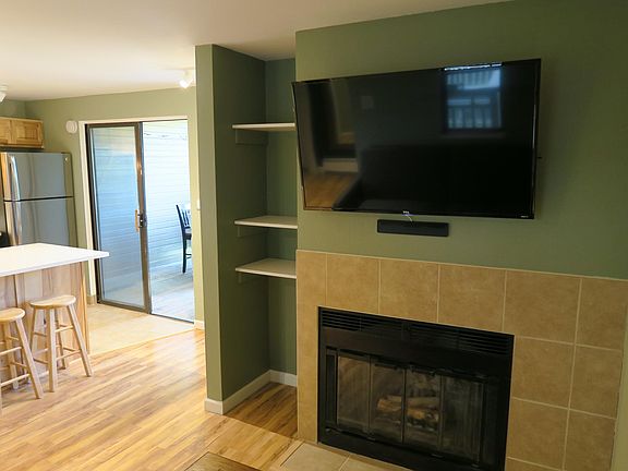 4K flat screen TV with HD antenna and working wood fireplace