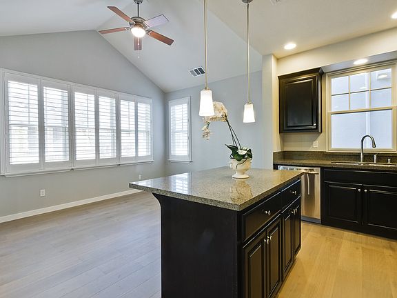 9 Ft Vaulted Ceiling with many windows.