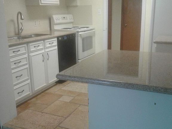 Kitchen new granite counter tops has dish washer,fridge,and stove