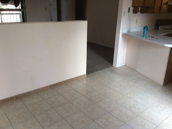 Dining room with living room on left and kitchen right