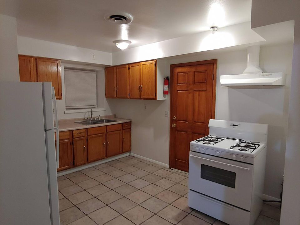 kitchen cabinets with Stove, Refrigerator and Microwave