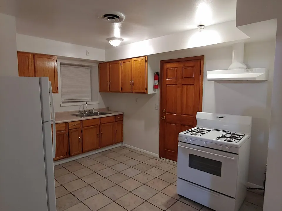 kitchen cabinets with Stove, Refrigerator and Microwave