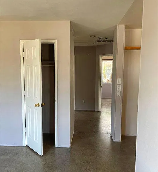 Living Room closet. View toward bedrooms through hallway.