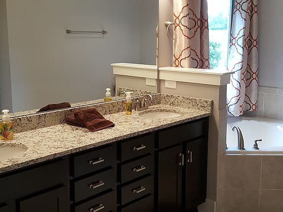 Double vanities, soaking tub