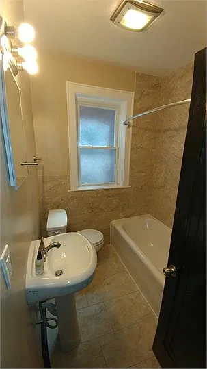 Newly renovated Full Bathroom with Porcelain Tile surround & floor!