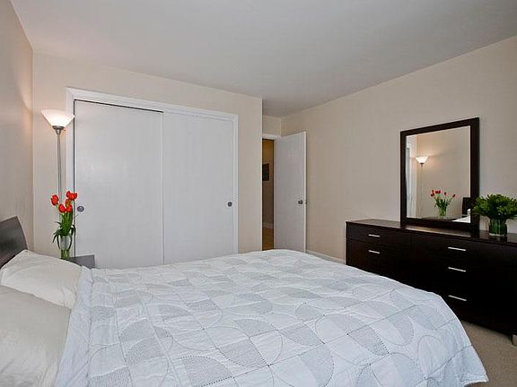 Large closet with closet system and 8 feet of closet space!