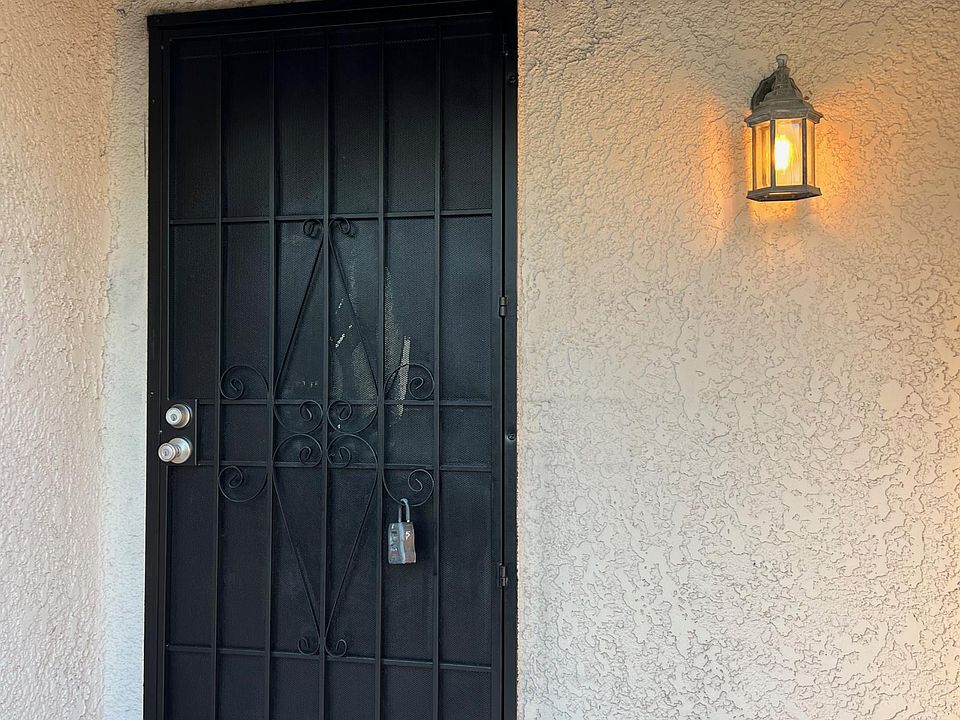 Entry door includes a security screen.