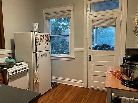 Kitchen 3, with back door to porch and parking area