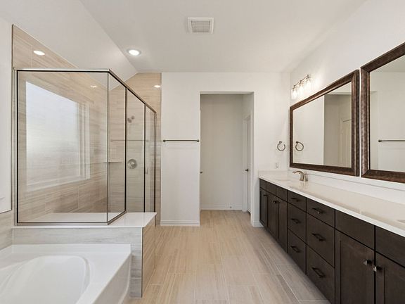 Spacious owner s bathroom with dual vanity and oversized shower