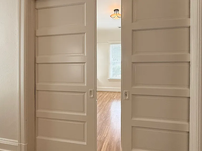 pocket doors dividing living room into two spaces