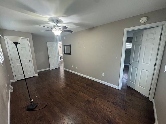 Bedroom 2 with doors to hallway and Bedroom 1
