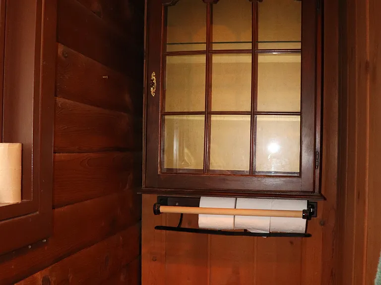 Cabinet storage above commode