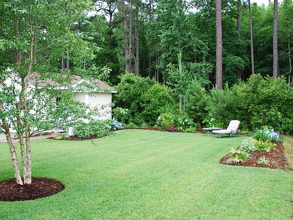 EXTENDED BACK YARD
						:
						PRIVATE, WOODED VIEW (NEVER ANY BUILDING BEHIND HOME) AND (1) CAR GARAGE