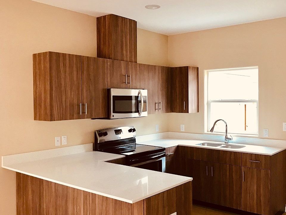 Open kitchen concept with modern appliances, quartz countertops