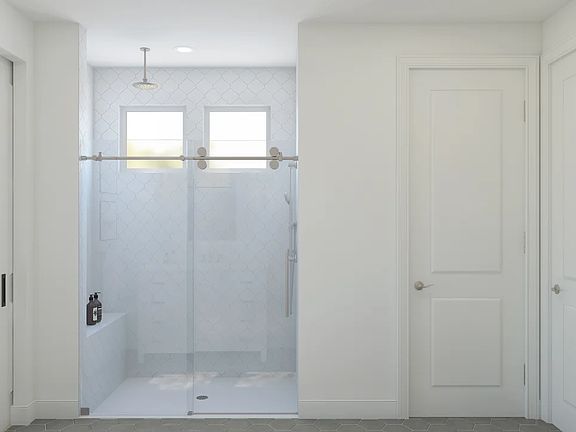Primary bath with glass-shower enclosure