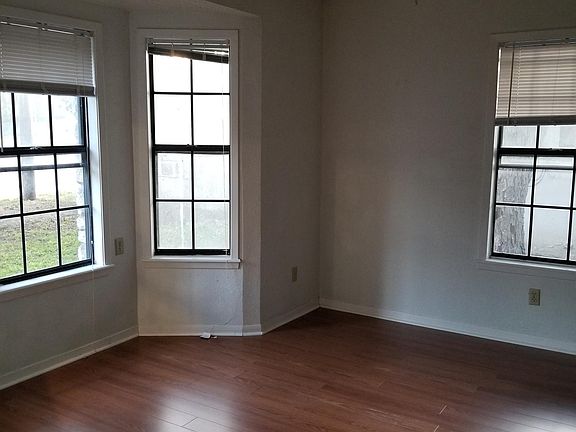 Bedroom with wood floors