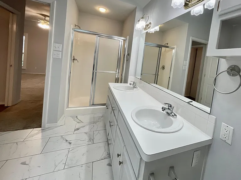 Primary Bathroom w/dual sinks, stand-alone shower and soaking tub.