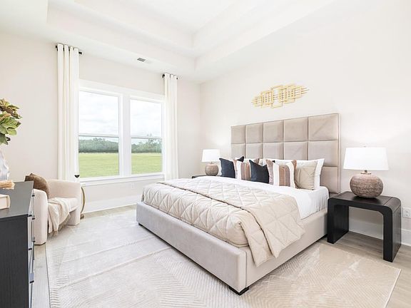 Luxurious first-floor primary bedroom