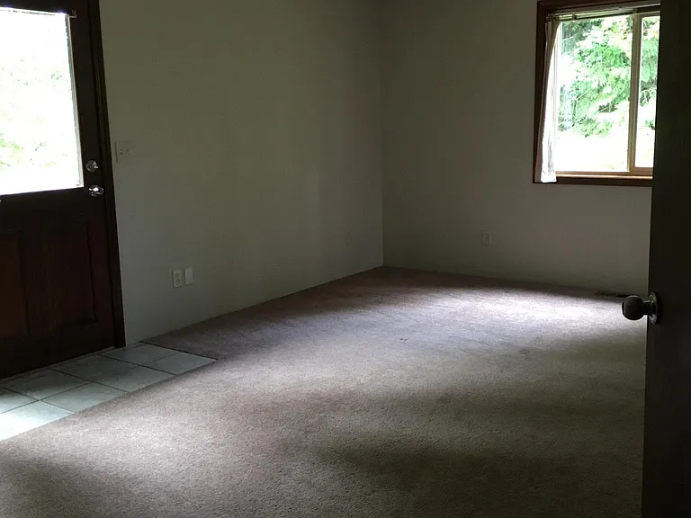 Master bedroom with walk-in closet and exterior access to deck and ADA accessible ramp