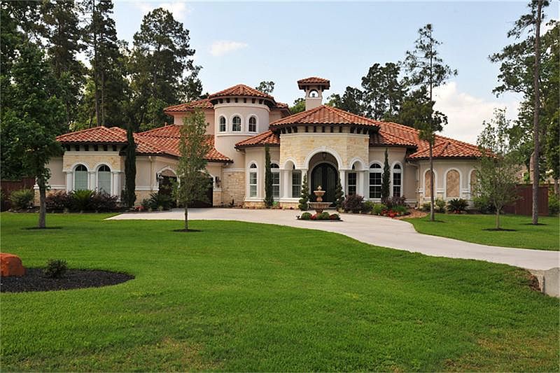 Elegant Tuscan charm greets you as you pull into the circular drive of this custom Mediterranean.The