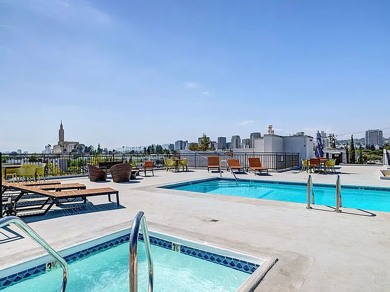 Rooftop heated pool/spa with 360 degree views of the city, lounge chairs and tanning beds.