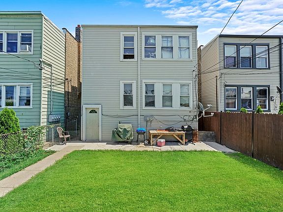 Back stairs from each unit are enclosed with exterior exit to backyard/parking