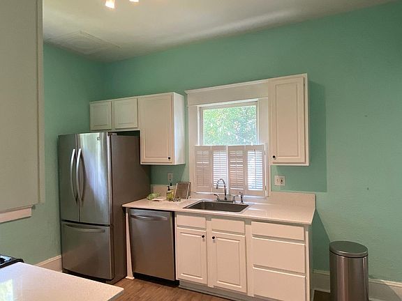 Kitchen, gas stove, microwave, fridge, and dishwasher. Plenty of cabinet space with a small pantry closet.