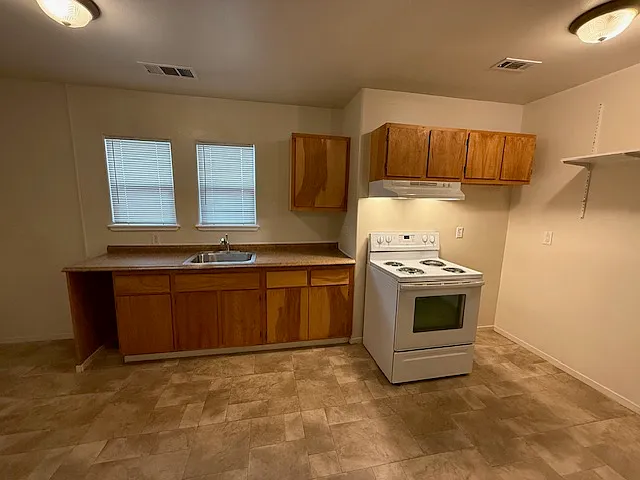 Kitchen completely refreshed, cabinets all sanded and refinished, electric stove/oven (self cleaning) included.