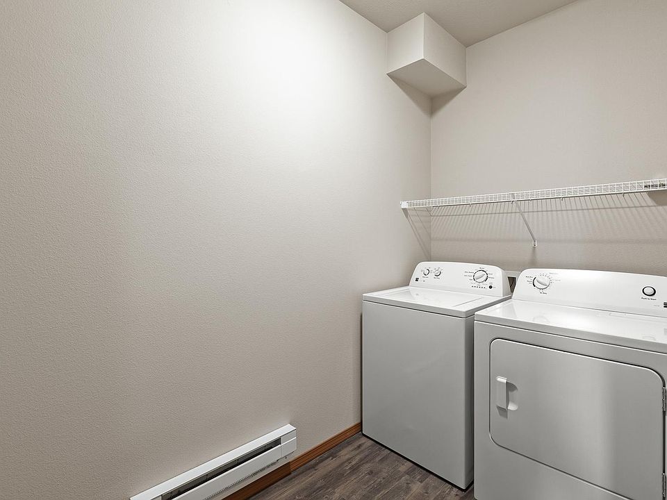 Full sizes washer and dryer and plenty of room in laundry room for laundry hampers.