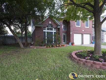 front view with flowerbeds