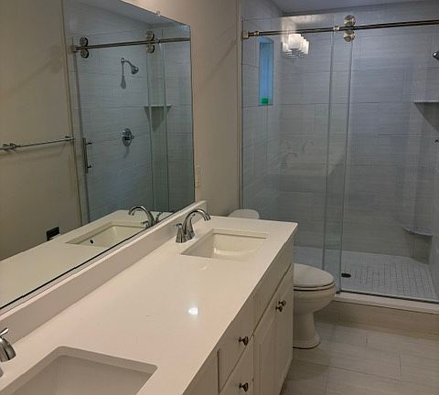 new bathroom tile and enclosure, new light fixtures, new shower door.