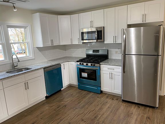 Stainless Steel Appliances, Moen Faucet, LED Light Fixtures.