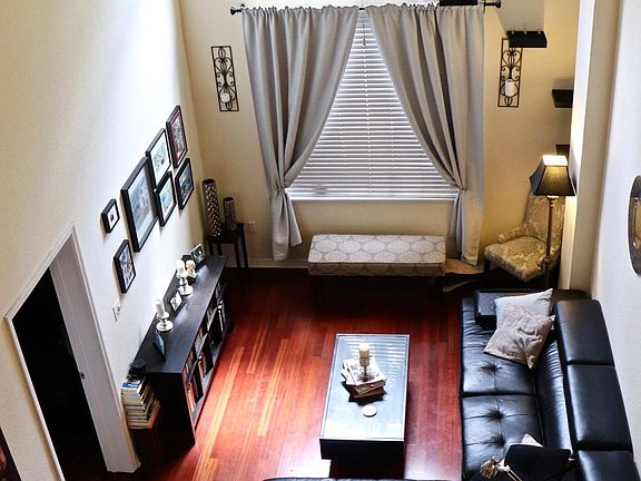 Living room area with cathedral height ceiling; plenty of light