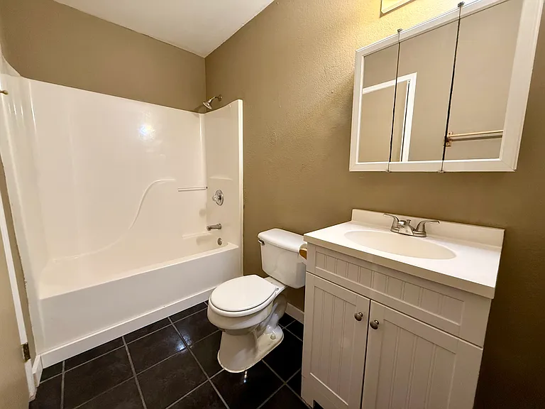 Shower/tub combo with over and under the sink storage.