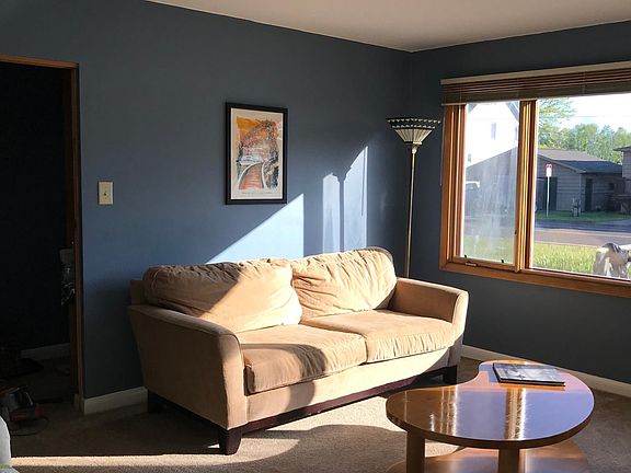 Large living room with full-size couch, love seat, and reclining chair. TV provided. Wi-fi provided.