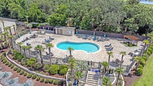 Experience indulgence on our sprawling sundeck surrounding our exclusive resort-style community pool. - The Fairpointe at Gulf Breeze