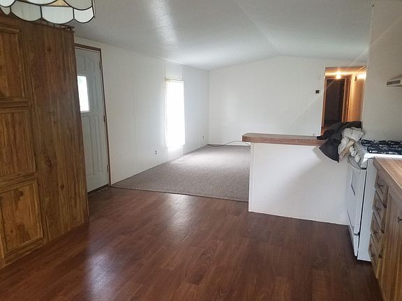 dinning / kitchen area with additional storage closets, open floor plan to large living room