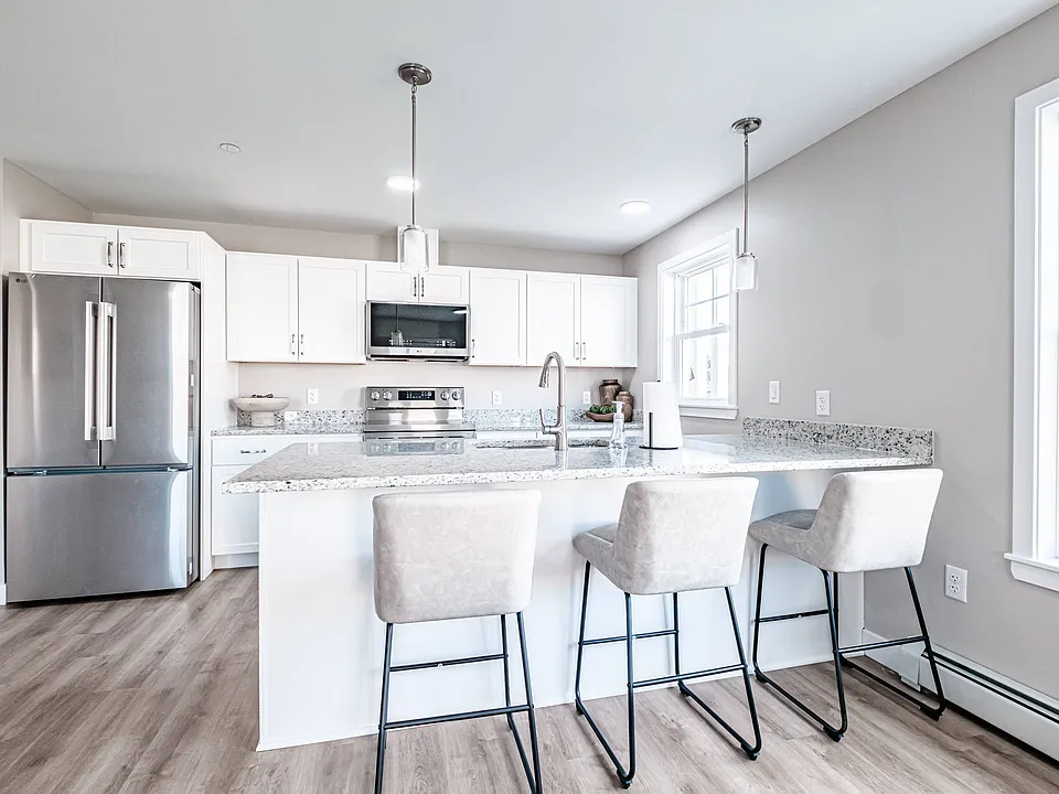 The heart of the home, this modern kitchen offers sleek stainless steel appliances, generous counter space, and a large island perfect for dining, entertaining, and everyday living.
