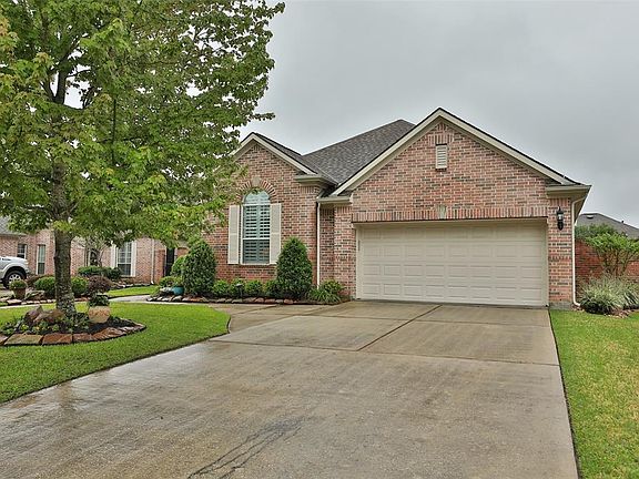 Double wide driveway, sprinklers front and back and double sidewalk entrance to front porch.