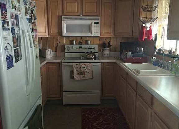 Kitchen before new floors/dishwasher