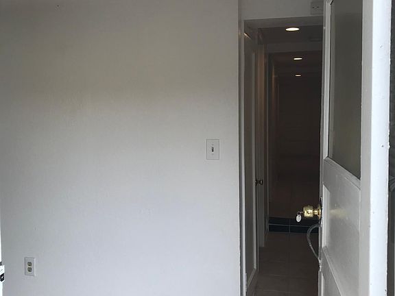 Entrance to Unit A. Hallway and dining area.